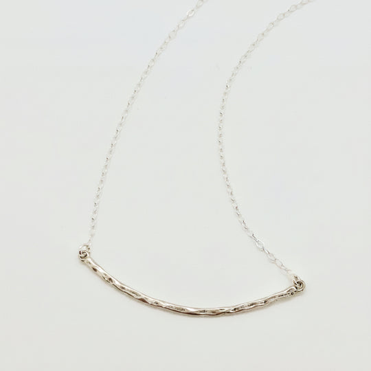 Silver Curved Skinny Bar Necklace, our delicate sterling silver necklace with a hand crafted hammered curved skinny bar on sterling silver chain, minimalist style charm necklace.