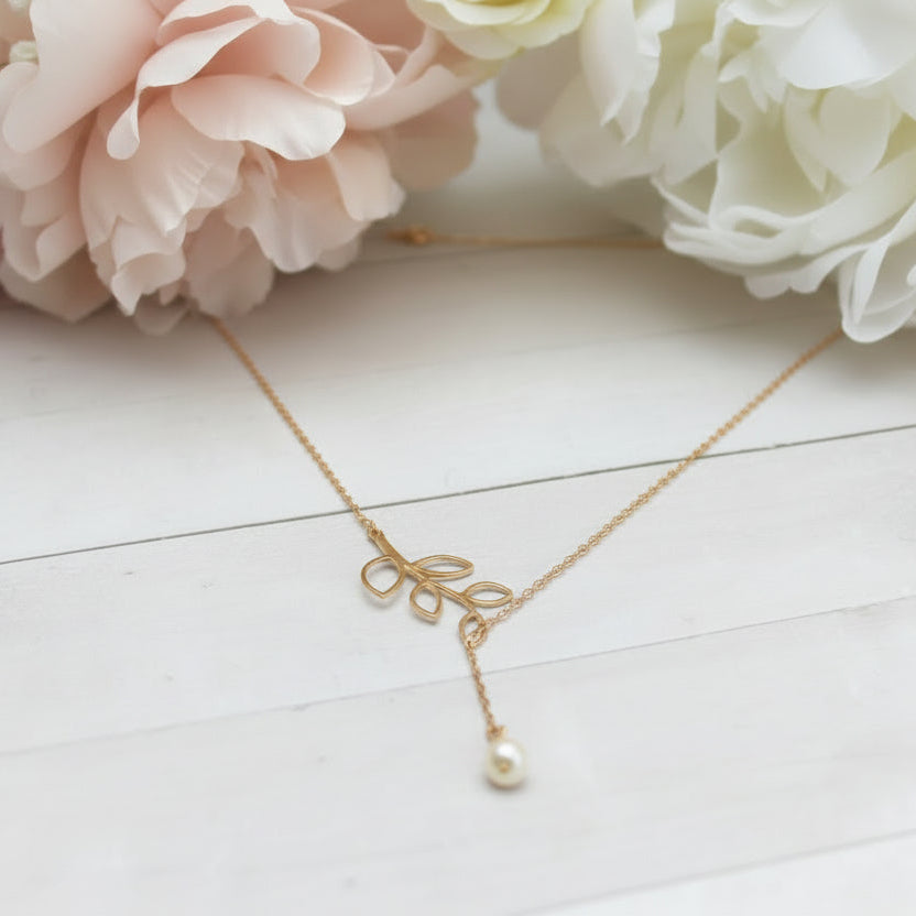 14K Gold Open Leaf Lariat Pearl Charm Necklace, our sweet 14k gold lariat necklace features a dainty open leaf charm with a adjustable design 