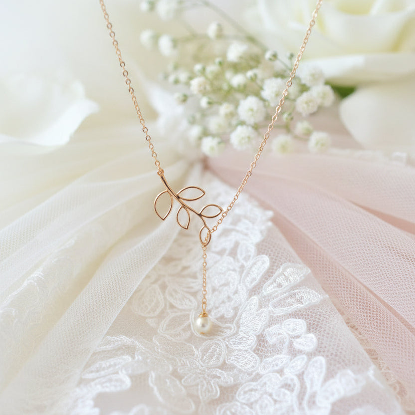 14K Gold Open Leaf Lariat Pearl Charm Necklace, our sweet 14k gold lariat necklace features a dainty open leaf charm with a adjustable design 