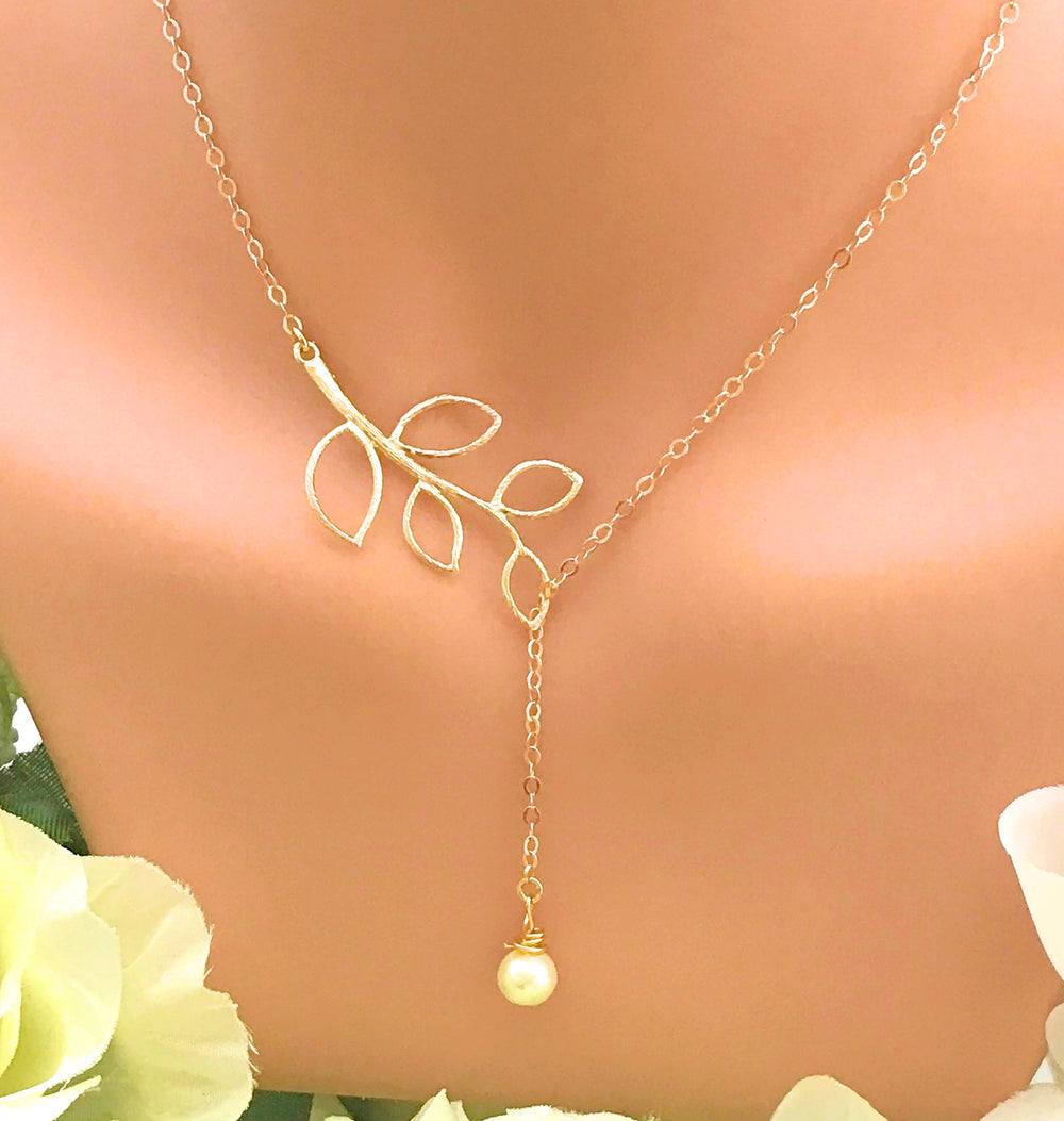 14K Gold Open Leaf Lariat Pearl Charm Necklace, our sweet 14k gold lariat necklace features a dainty open leaf charm with a adjustable design 