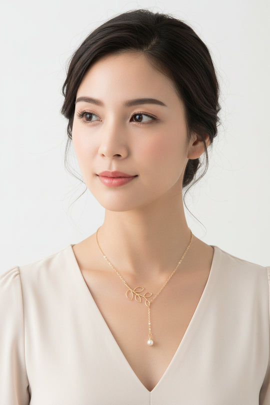 14K Gold Open Leaf Lariat Pearl Charm Necklace, our sweet 14k gold lariat necklace features a dainty open leaf charm with a adjustable design 