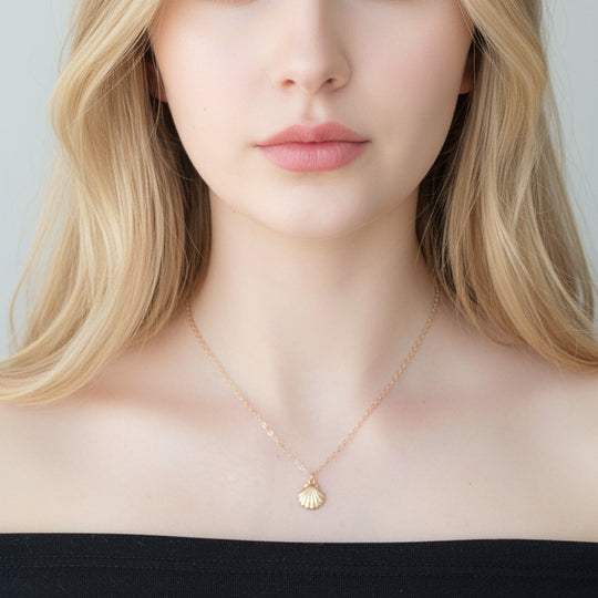 14K Gold Tiny Mermaid Shell Charm Necklace, our tiny mermaid clam shell charm is on 14k gold-filled chain, with a textured front like a clam shell, t