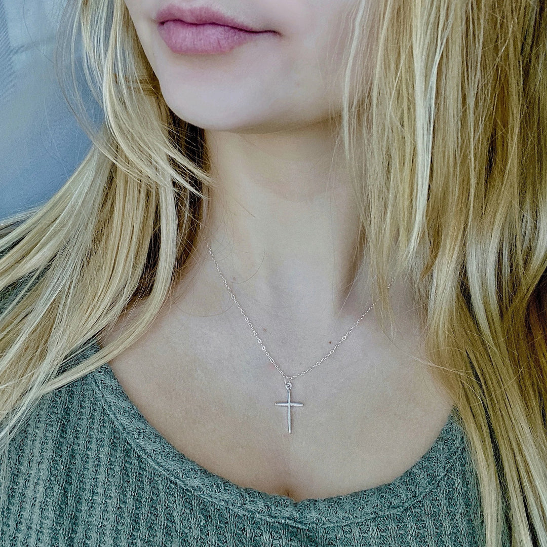 Sterling Silver Cross Necklace, on sterling silver chain, minimalist in style, a craftsman like silver cross charm.