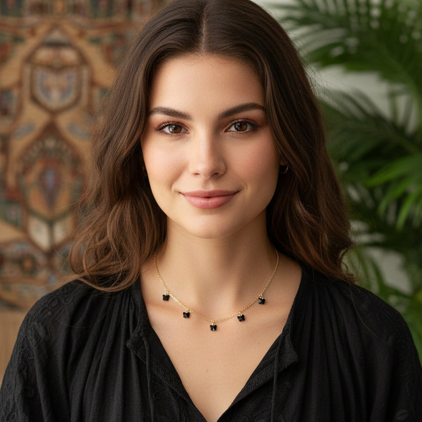 Black Crystal Butterfly Necklace showcased on a mannequin, featuring delicate black crystal butterflies on a gold-fill chain.