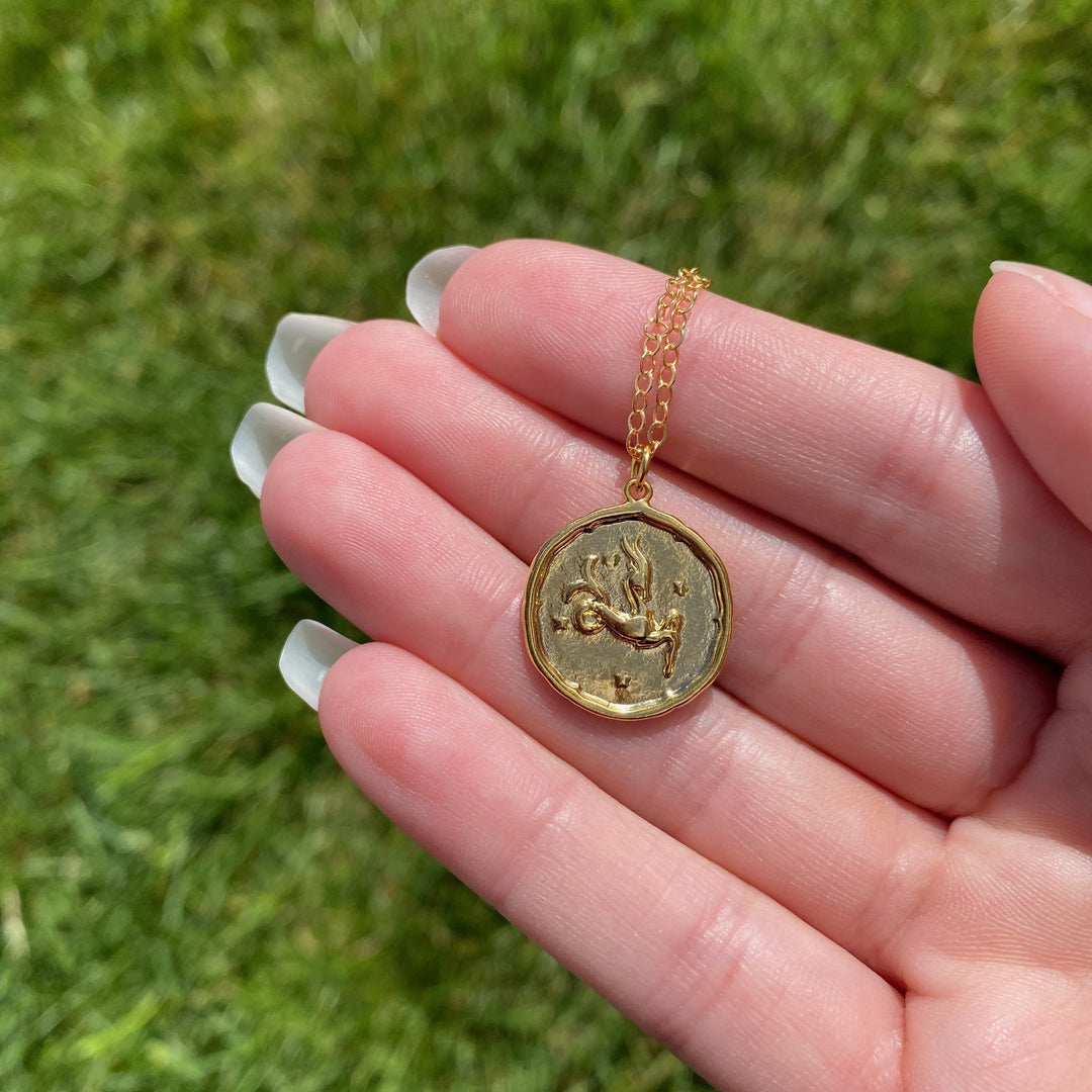 Capricorn Zodiac Sign Gold Necklace, this hand crafted Capricorn Zodiac Disk Necklace features a 14K gold-filled chain and an 18K vermeil gold charm.