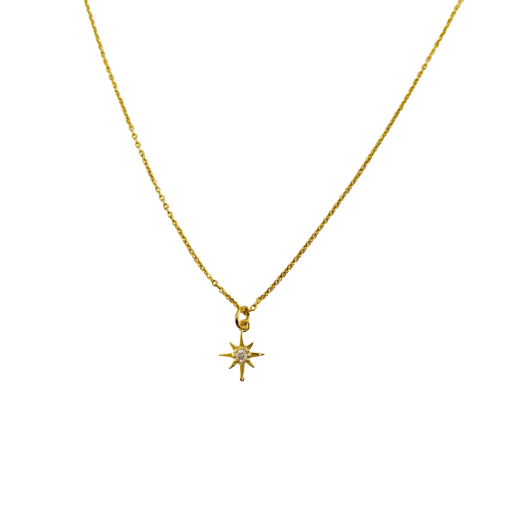 14K Gold Eight Point Star Charm Necklace, our dainty gold star necklace has an eight-point star charm with a cubic zirconia center on a 14k gold-filled chain