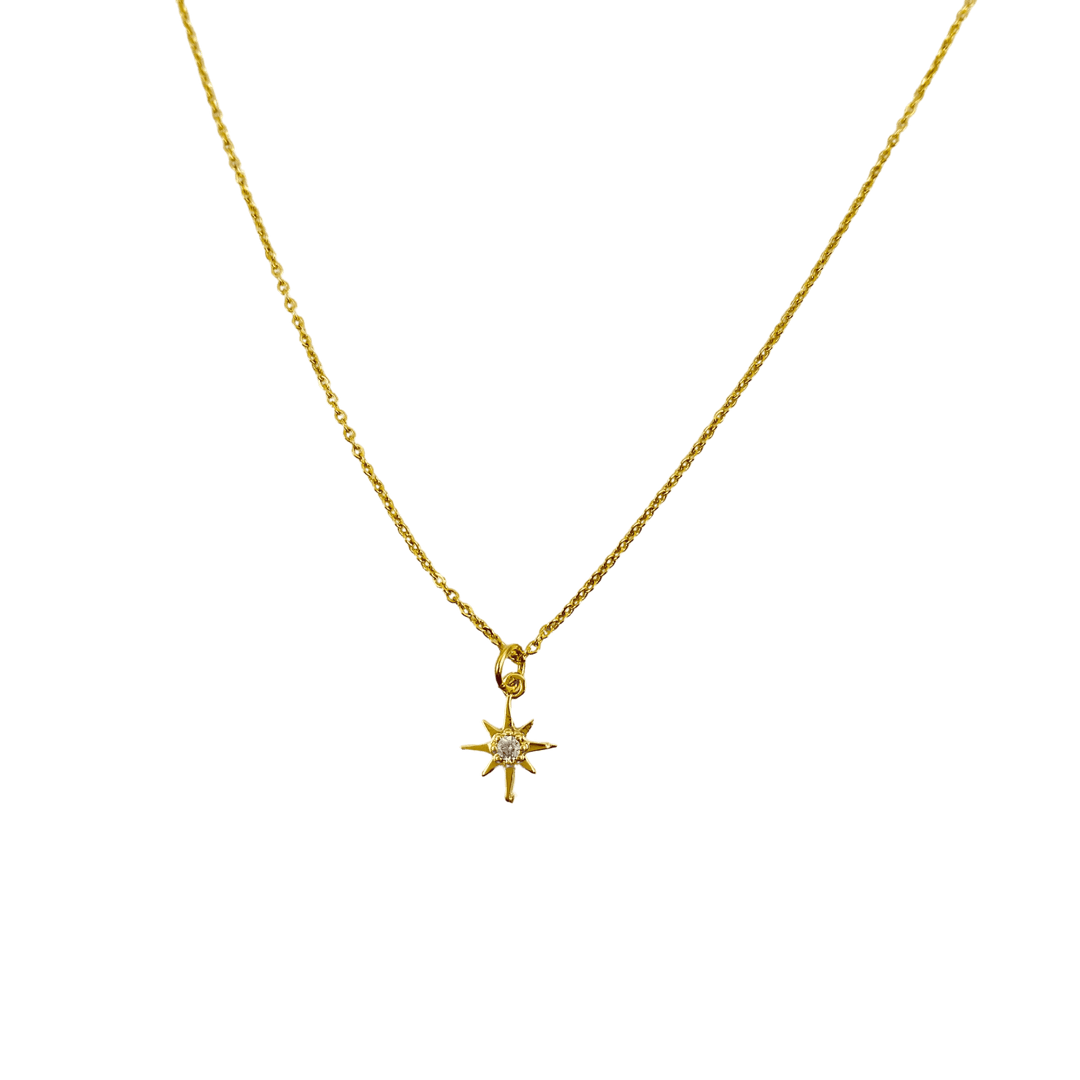 14K Gold Eight Point Star Charm Necklace, our dainty gold star necklace has an eight-point star charm with a cubic zirconia center on a 14k gold-filled chain
