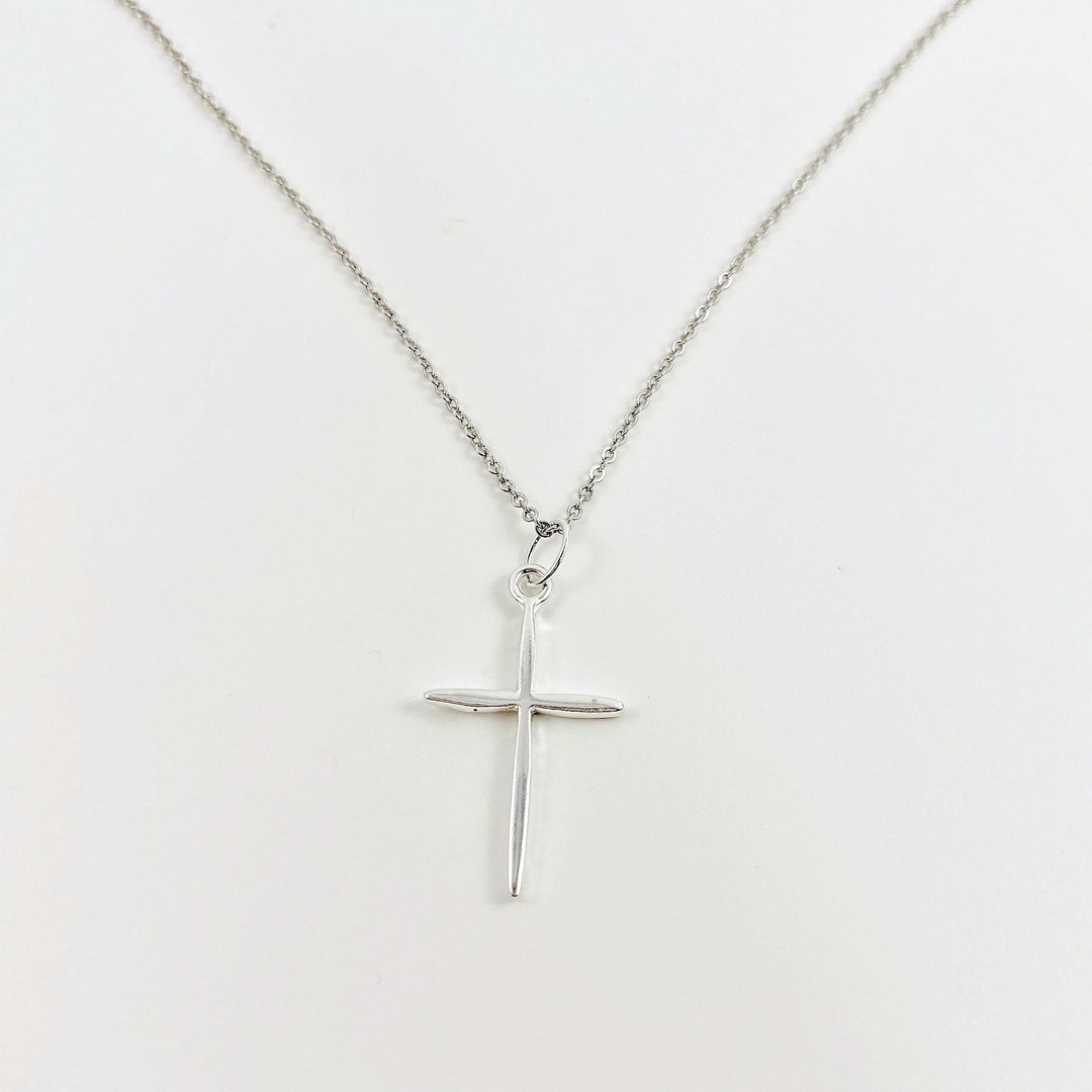 Sterling Silver Cross Necklace, on sterling silver chain, minimalist in style, a craftsman like silver cross charm.