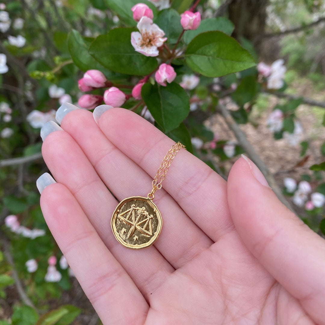 Libra Zodiac Sign Gold Necklace, this hand crafted Libra Zodiac Sign Necklace features a 14K gold-filled chain and an 18K vermeil gold charm. A