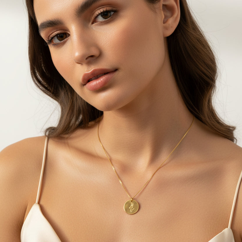 Gold Hand Stamped Mermaid Necklace, our tiny sweet mermaid is hand stamped on a gold disk with a 14k gold filled chain, it's adoring charm makes an endless treasure.