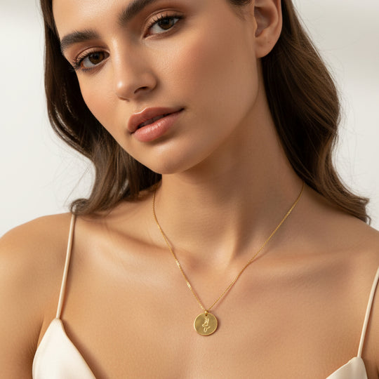Gold Hand Stamped Mermaid Necklace, our tiny sweet mermaid is hand stamped on a gold disk with a 14k gold filled chain, it's adoring charm makes an endless treasure.