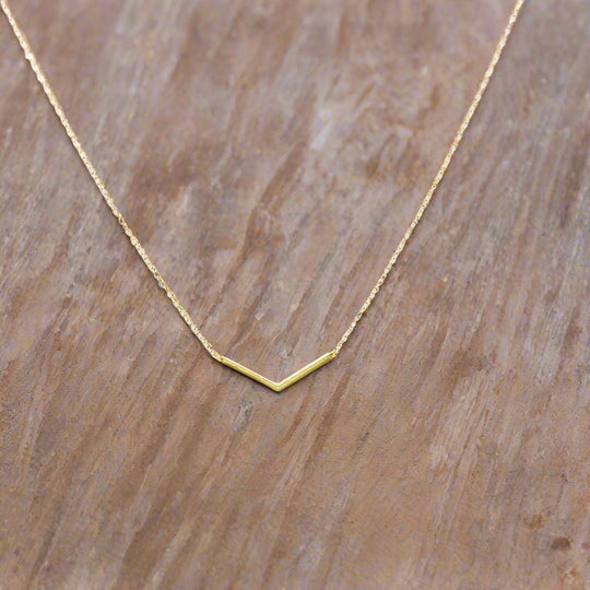 14K Gold Chevron V Bar Charm Necklace, our petite chevron V bar charm on 14k gold-filled chain equals a sweet minimalist charm necklace for everyday wear.
