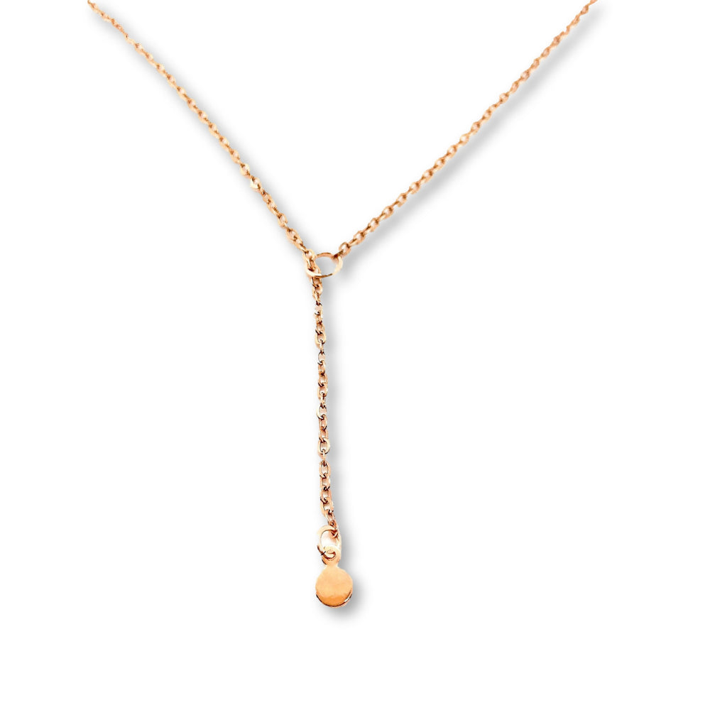 Rose Gold Dot Lariat Charm Necklace, a tiny rose gold dot charm hangs from the sparkling rose gold chain as a lariat with a petite rose gold circle for the slide through
