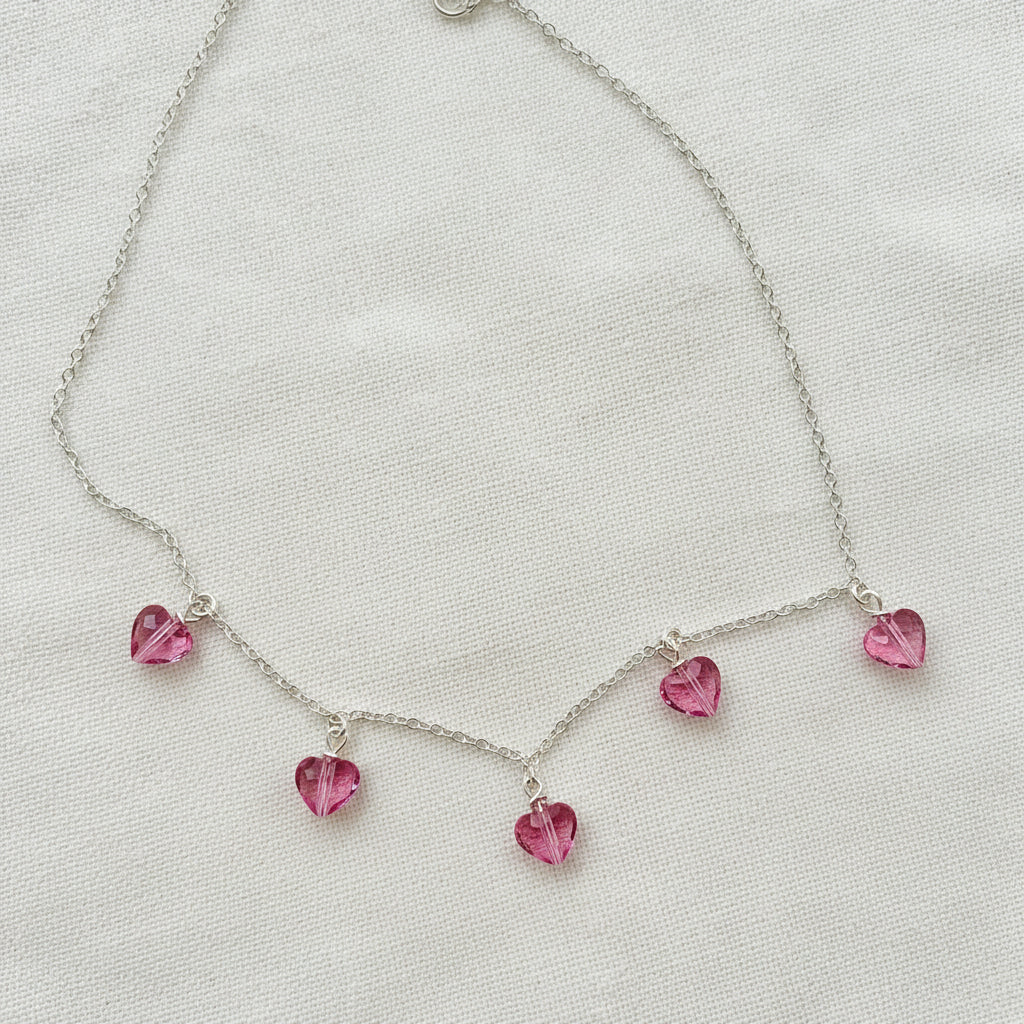 Pink Crystal Heart Necklace Jewelry, This Pink Crystal Heart Necklace is irresistibly sweet and petite, featuring five tiny heart-shaped crystals wire wrapped 