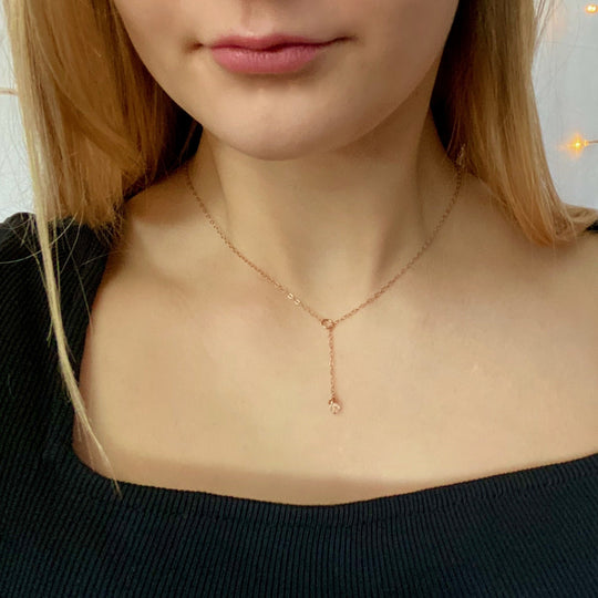 Rose Gold Crystal Lariat Charm Necklace, a tiny clear crystal hand wire-wrapped on rose gold chain completes this lariat with a petite circle charm for the slide of the lariat, 