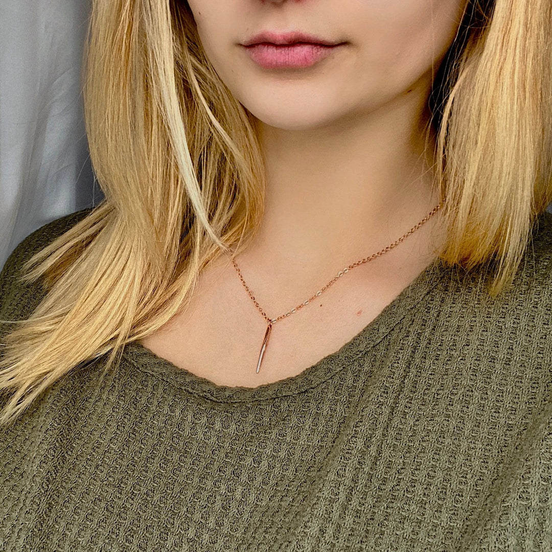Rose Gold Needle Spike Charm Necklace, our dainty necklace features a minimalist rose gold needle spike charm suspended from a slender rose gold chain