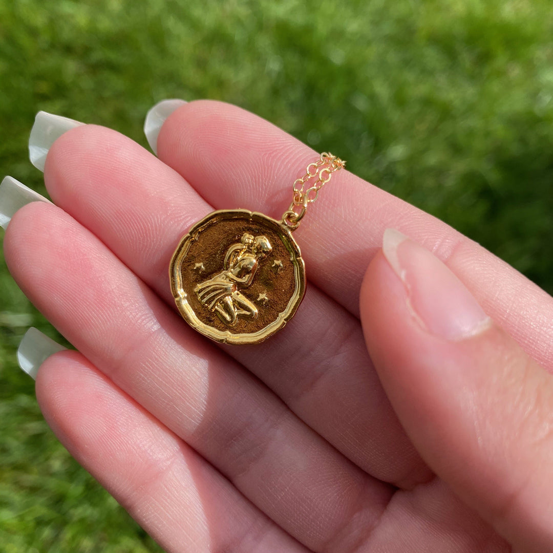 Virgo Zodiac Sign Gold Necklace, this hand crafted Virgo Zodiac sign Necklace features a 14K gold-filled chain and an 18K vermeil gold charm. 